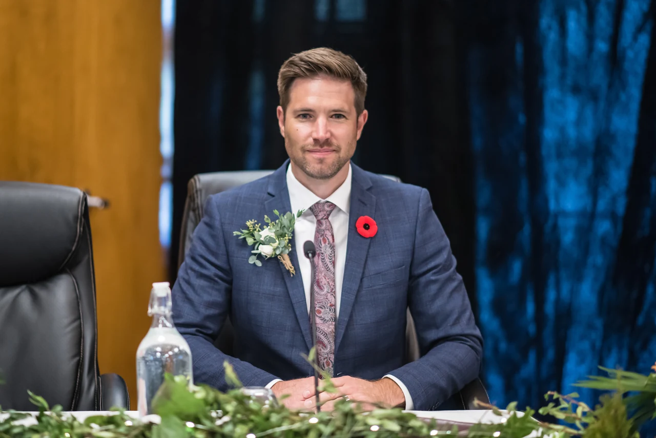 Stephen Johnston at the 2022 council inauguration, wearing a suit, tie and poppy.