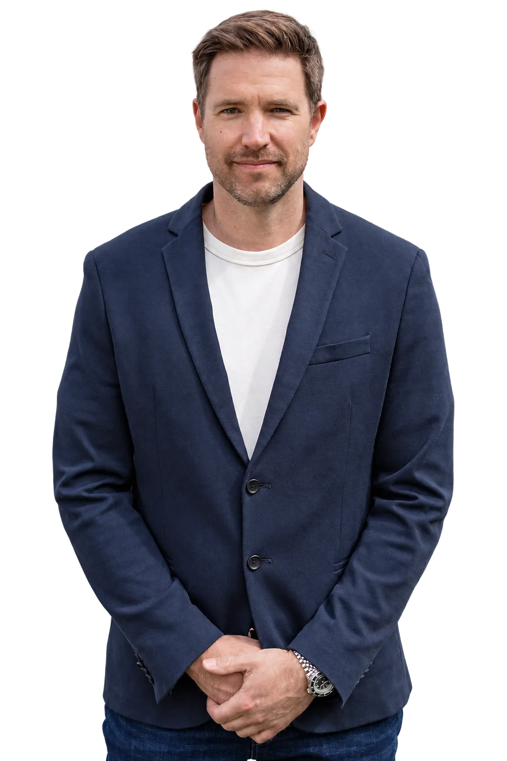 Stephen Johnston wearing a navy blazer and white crew-neck shirt.